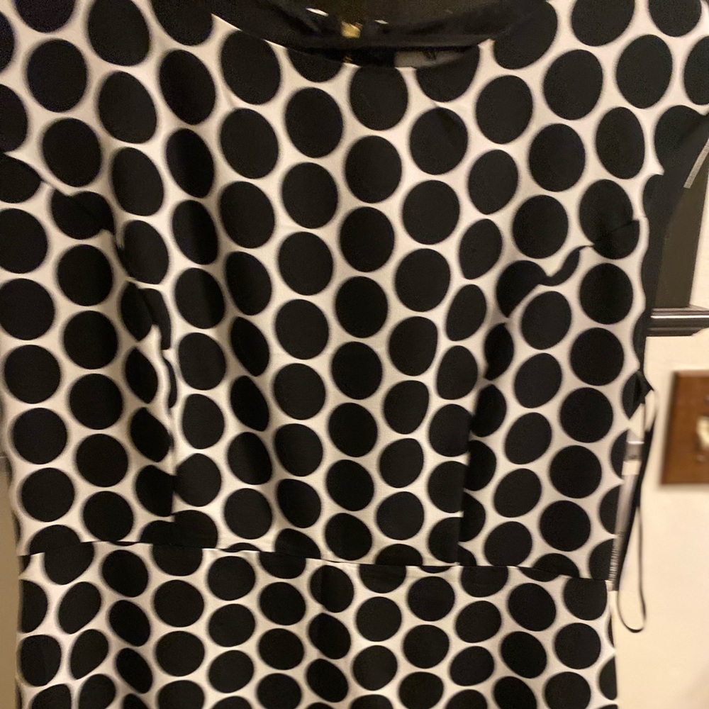 Black and white polka dot dress. Hits above knee.